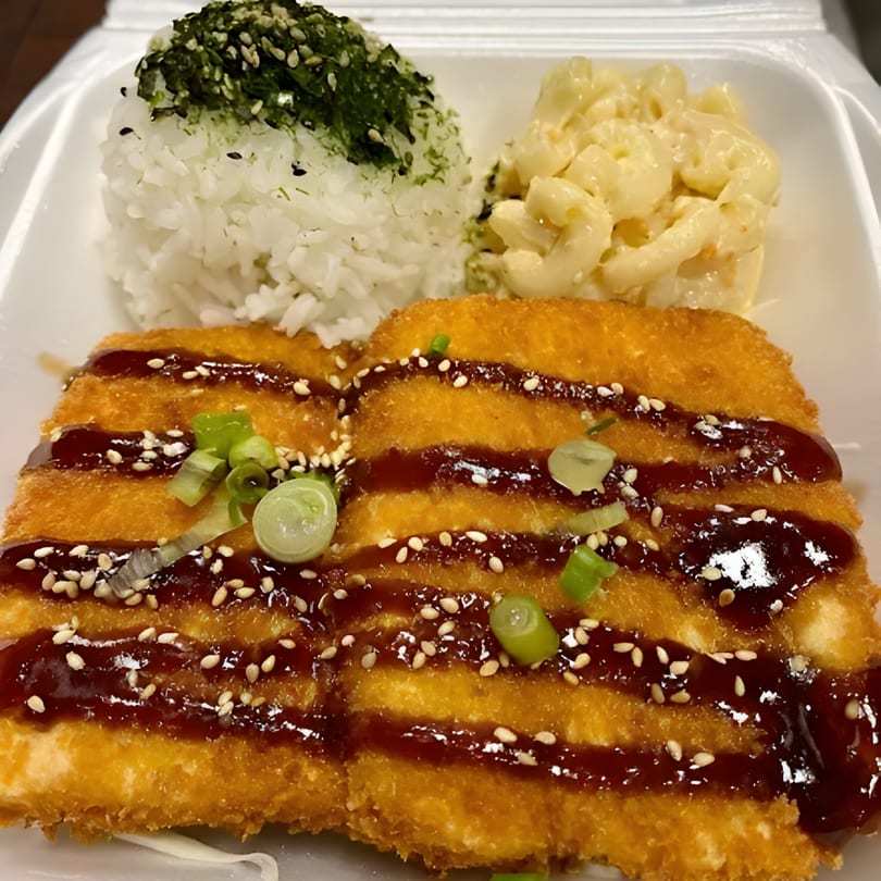 Poke Etc's fried tofu with teriyaki sauce, rice, and macaroni salad in a takeout container.